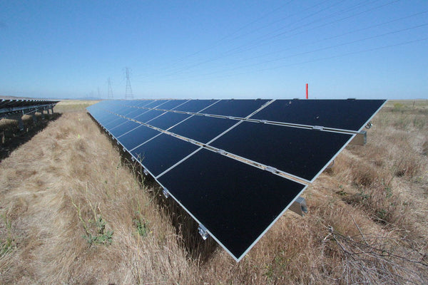Off-grid battery bank and solar array supplying a remote cabin without grid connection