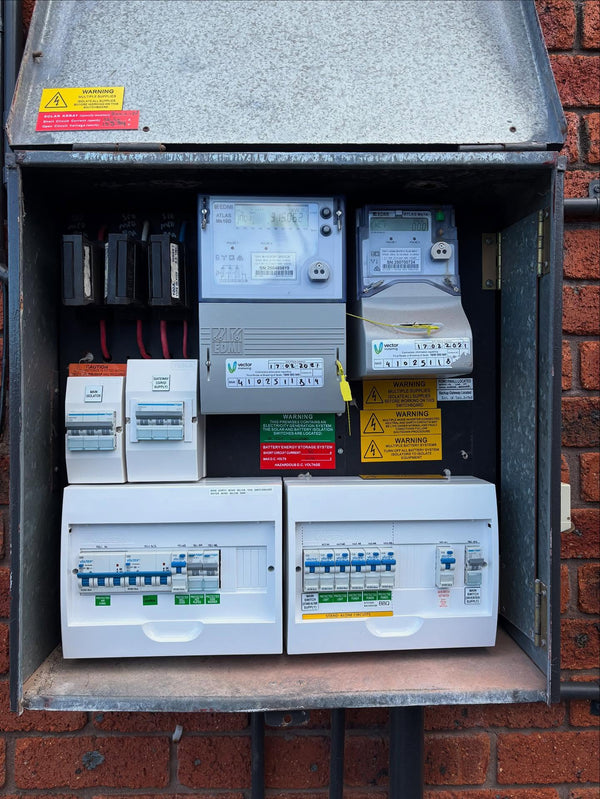 Wall-mounted home battery energy storage cabinet installed in a residential garage