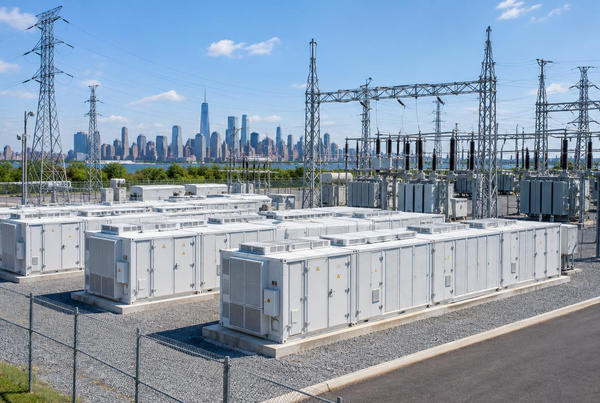 Utility-scale lithium battery energy storage containers installed beside a New York power substation