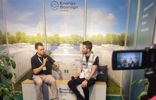 Moonwatt co-founders presenting sodium-ion battery technology at Intersolar 2026 Smarter E Europe trade show predicting LCOS cost parity with LFP within three years